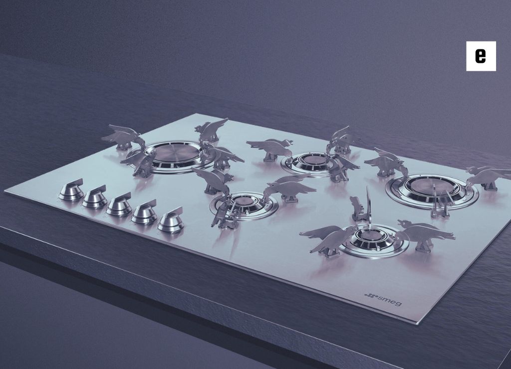 نمای نزدیک از اجاق گاز با طراحی خلاقانه که تزئین شده با پرنده‌های فلزی روی سطح آن.

