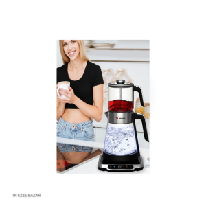 کتری ۱.۷ لیتری در حال تولید بخار روی پایه مشکی چای ساز مباشی ME-TM305.